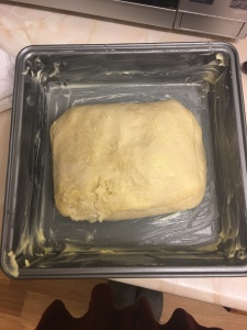 Kouign amann dough in cake tin