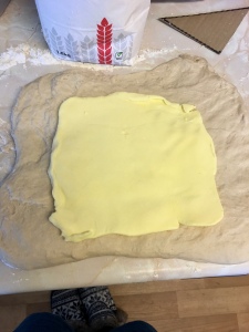 Butter on top of croissant dough